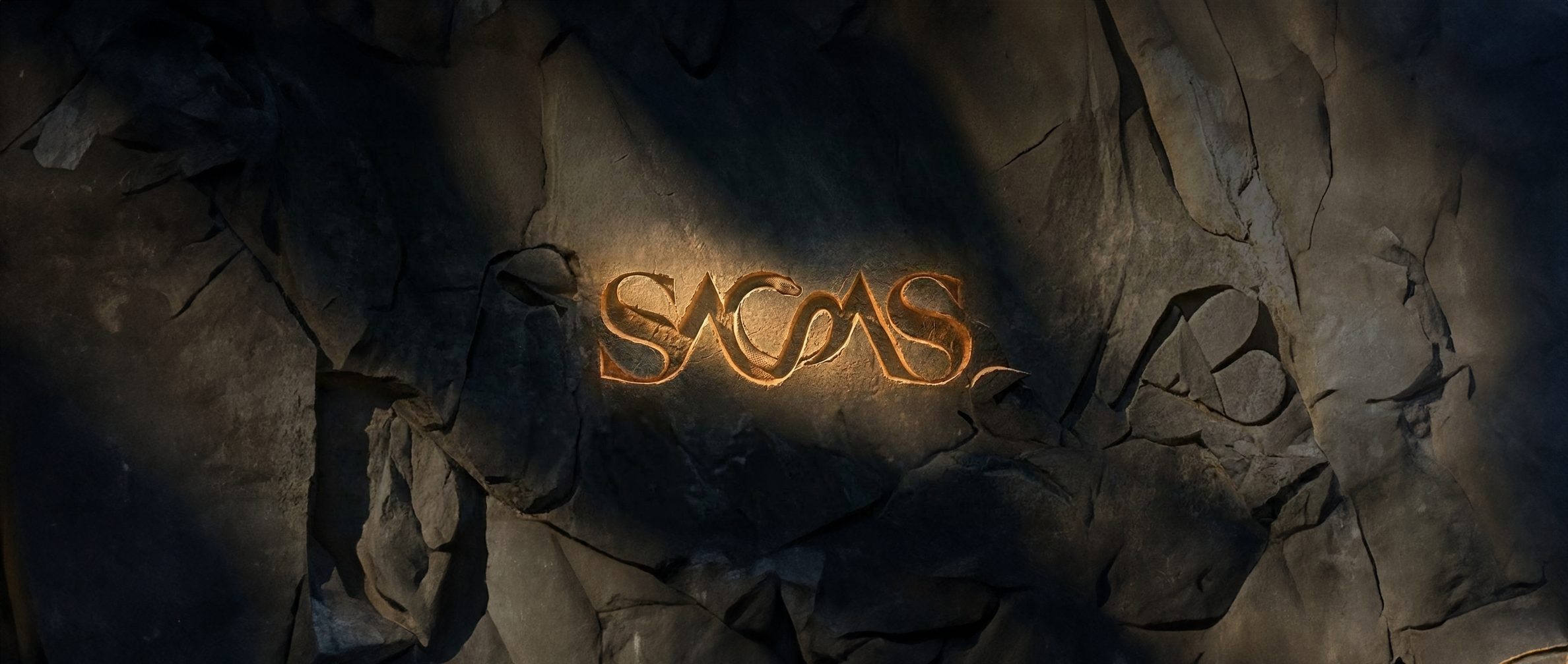 The SAGAS wordmark cut into dark rock, lit by a shaft of light